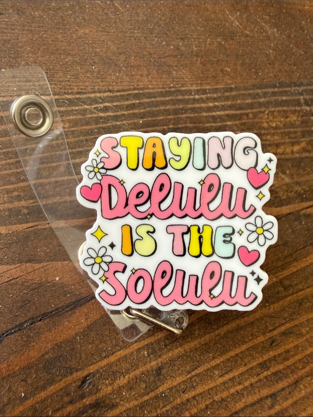 “Staying Deluxu is the Solulu”- badge reel Pink Yellow Accent